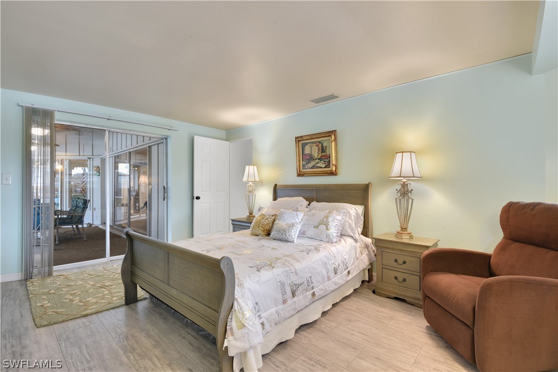 5970 Adele Court Fort Myers, FL 33919 - Photo 12 of 28 a bedroom with a bed and a couch