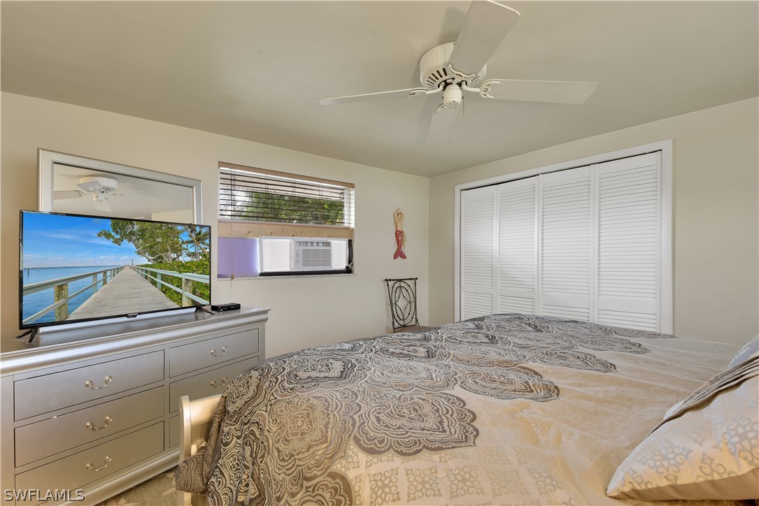 5970 Adele Court Fort Myers, FL 33919 - Photo 15 of 28 a bedroom with a bed and a dresser