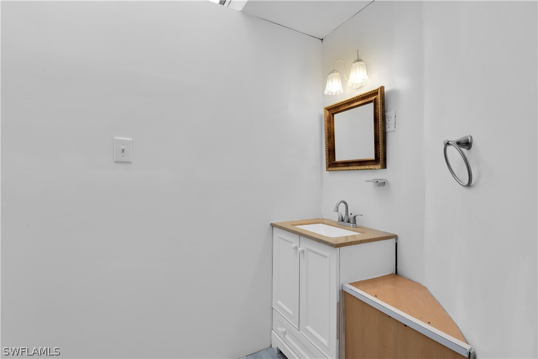 5970 Adele Court Fort Myers, FL 33919 - Photo 21 of 28 a bathroom with a sink and a mirror