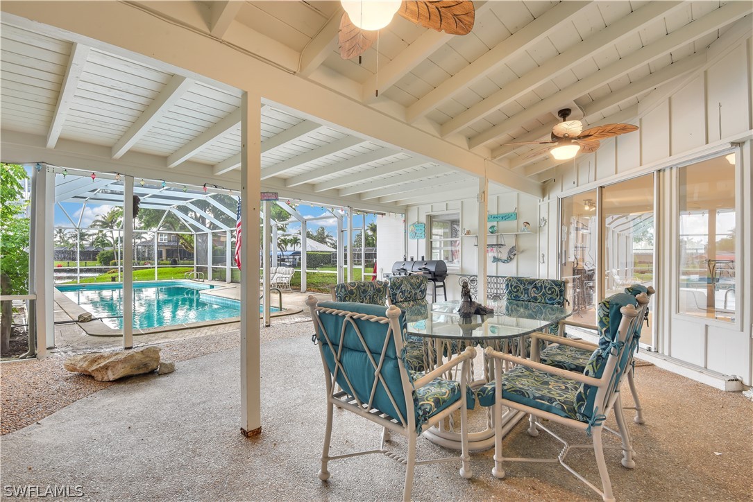 5970 Adele Court Fort Myers, FL 33919 - Photo 4 of 28 a dining room with furniture and a floor to ceiling window