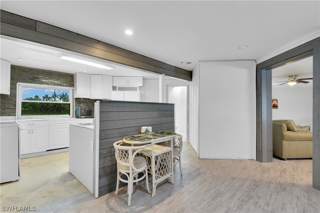 5970 Adele Court Fort Myers, FL 33919 - Photo 7 of 28 a kitchen with a table and chairs