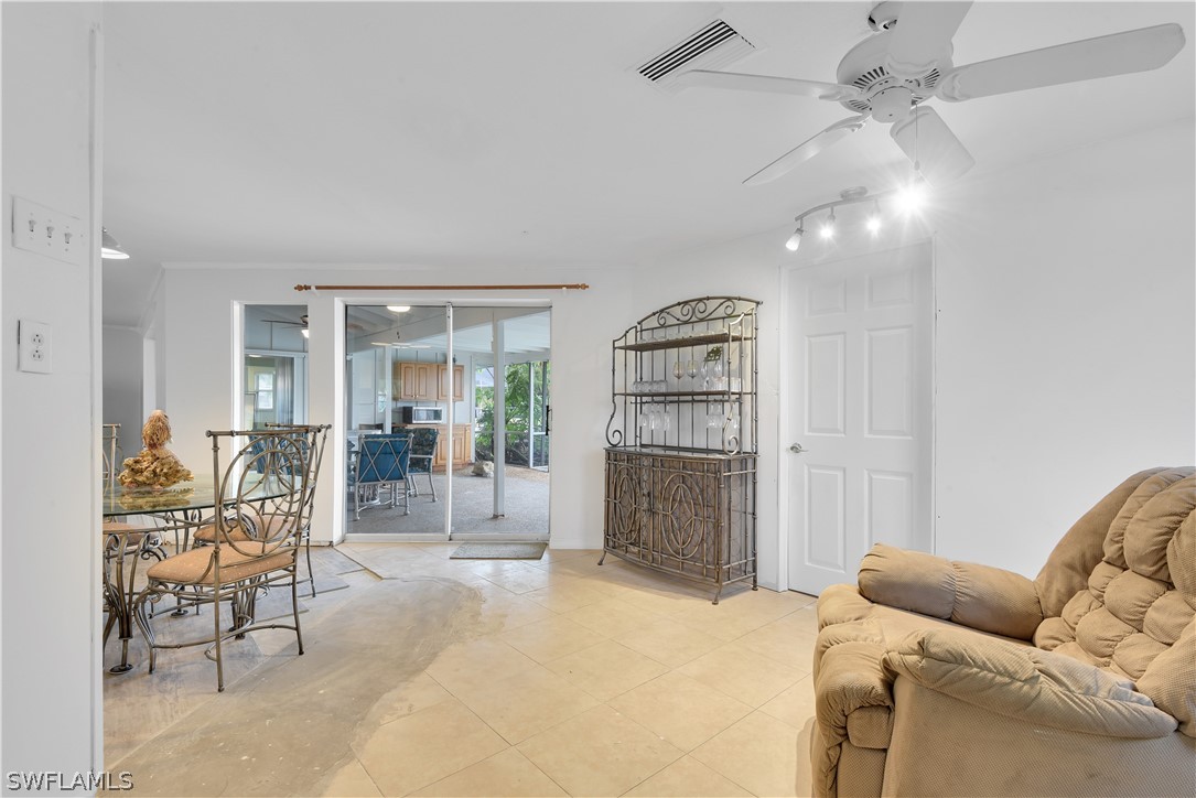 5970 Adele Court Fort Myers, FL 33919 - Photo 9 of 28 a bedroom with furniture and a fireplace