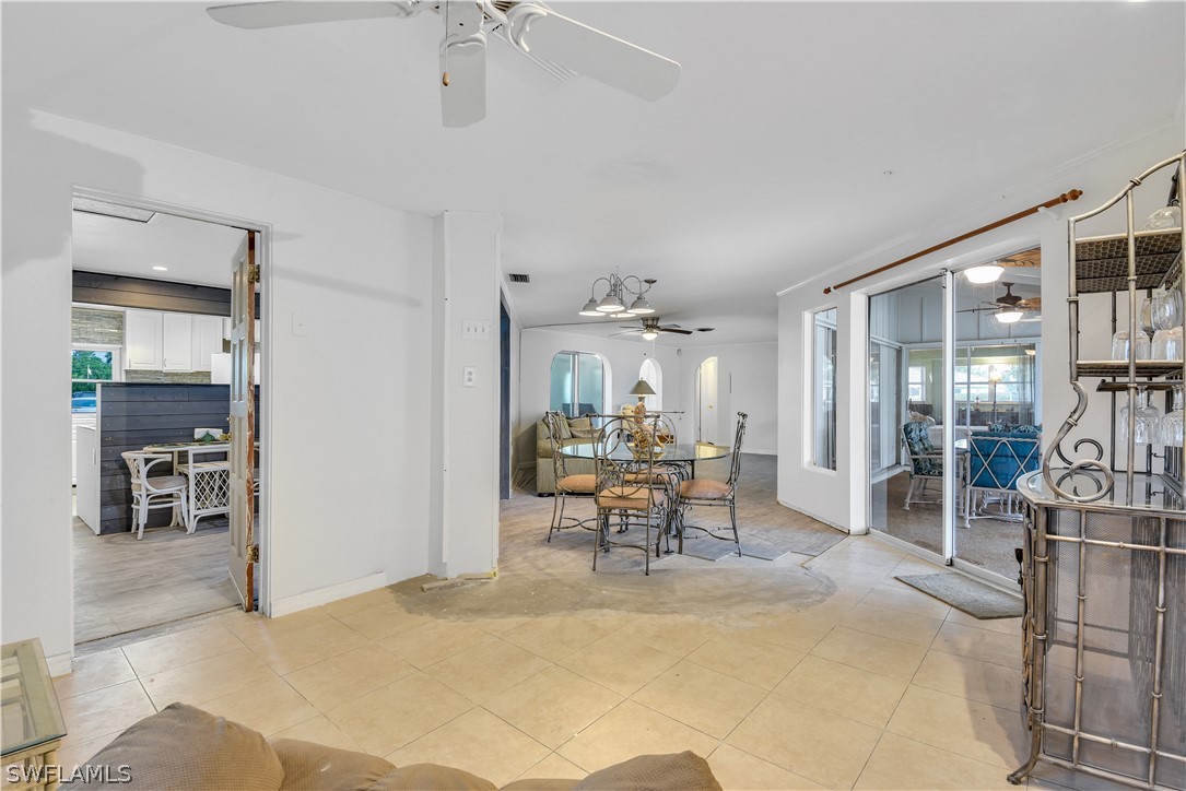 5970 Adele Court Fort Myers, FL 33919 - Photo 10 of 28 a living room with furniture a dining table and chairs