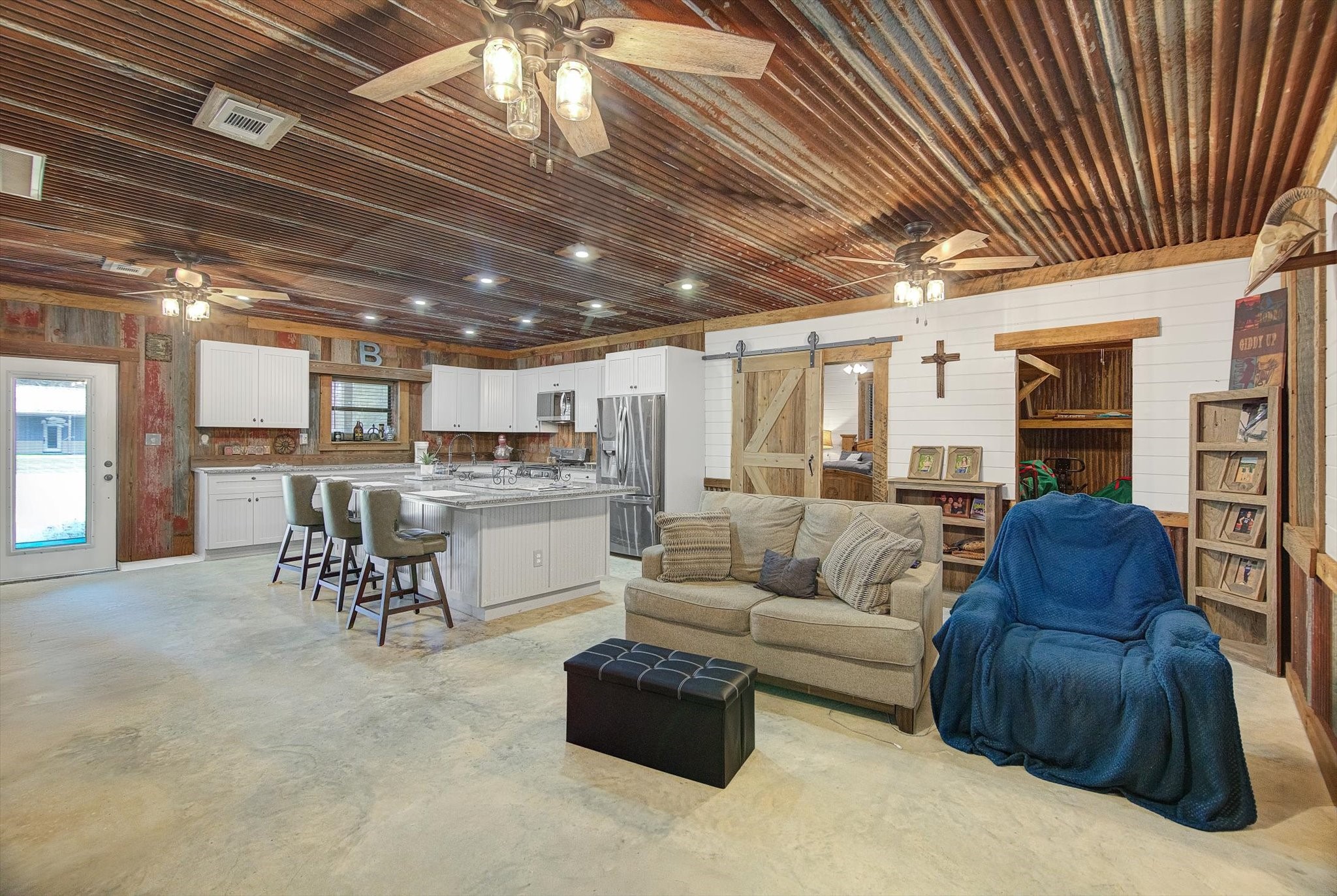 22546 Highway 321 Cleveland, TX 77327 - Photo 11 of 34 a living room with furniture and kitchen view