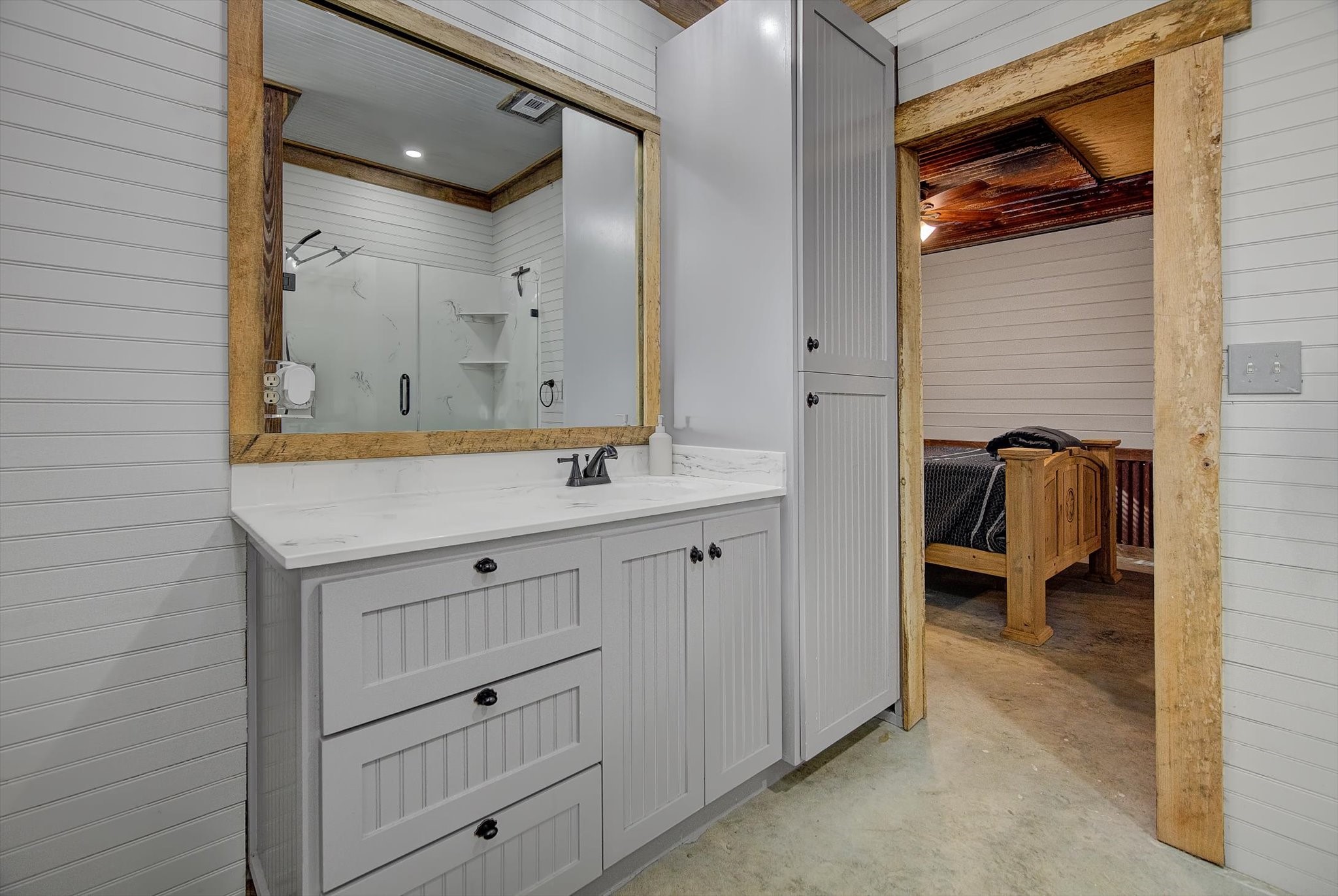 22546 Highway 321 Cleveland, TX 77327 - Photo 22 of 34 a bathroom with a sink a mirror and a shower