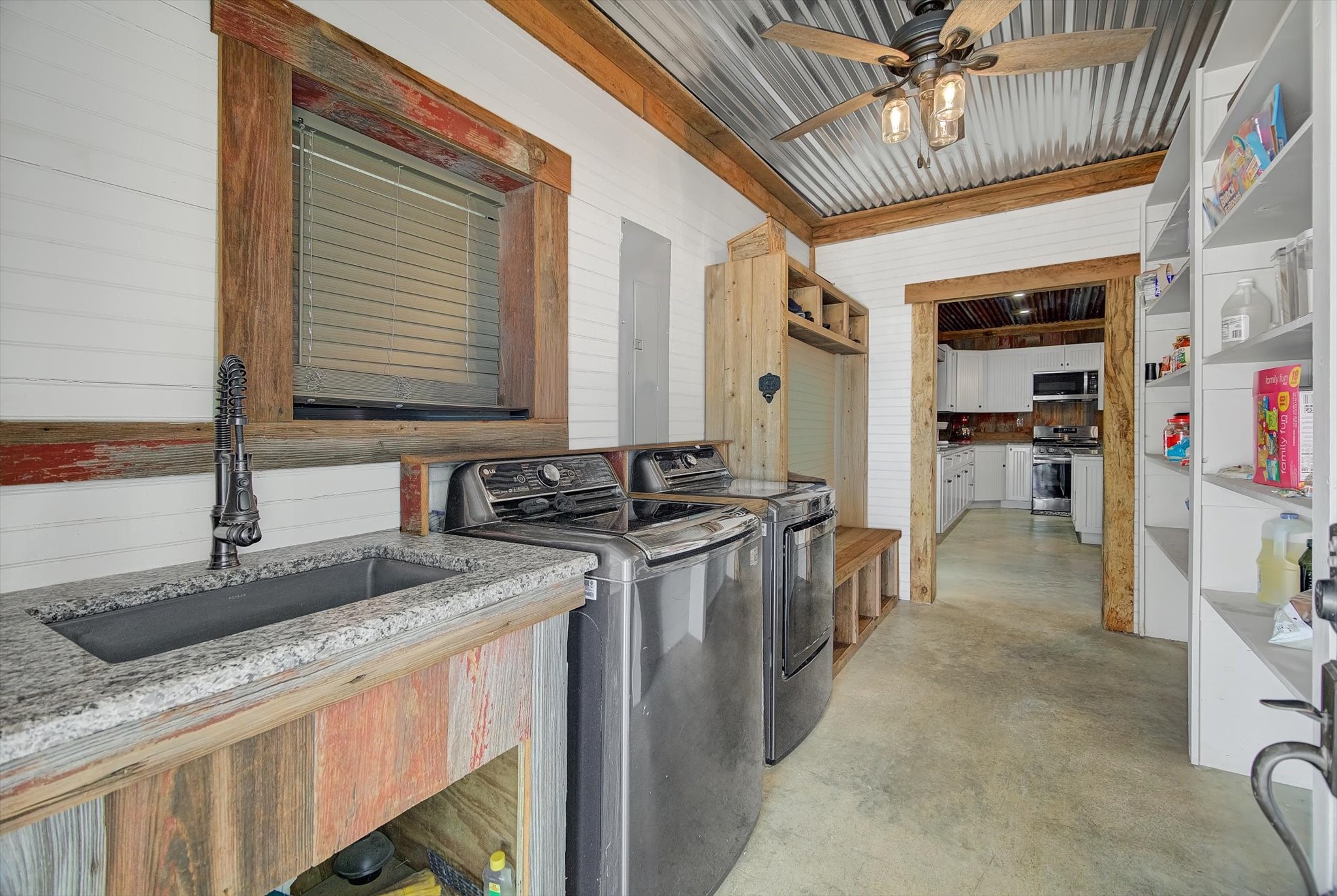 22546 Highway 321 Cleveland, TX 77327 - Photo 26 of 34 a kitchen with stainless steel appliances granite countertop a sink stove and cabinets