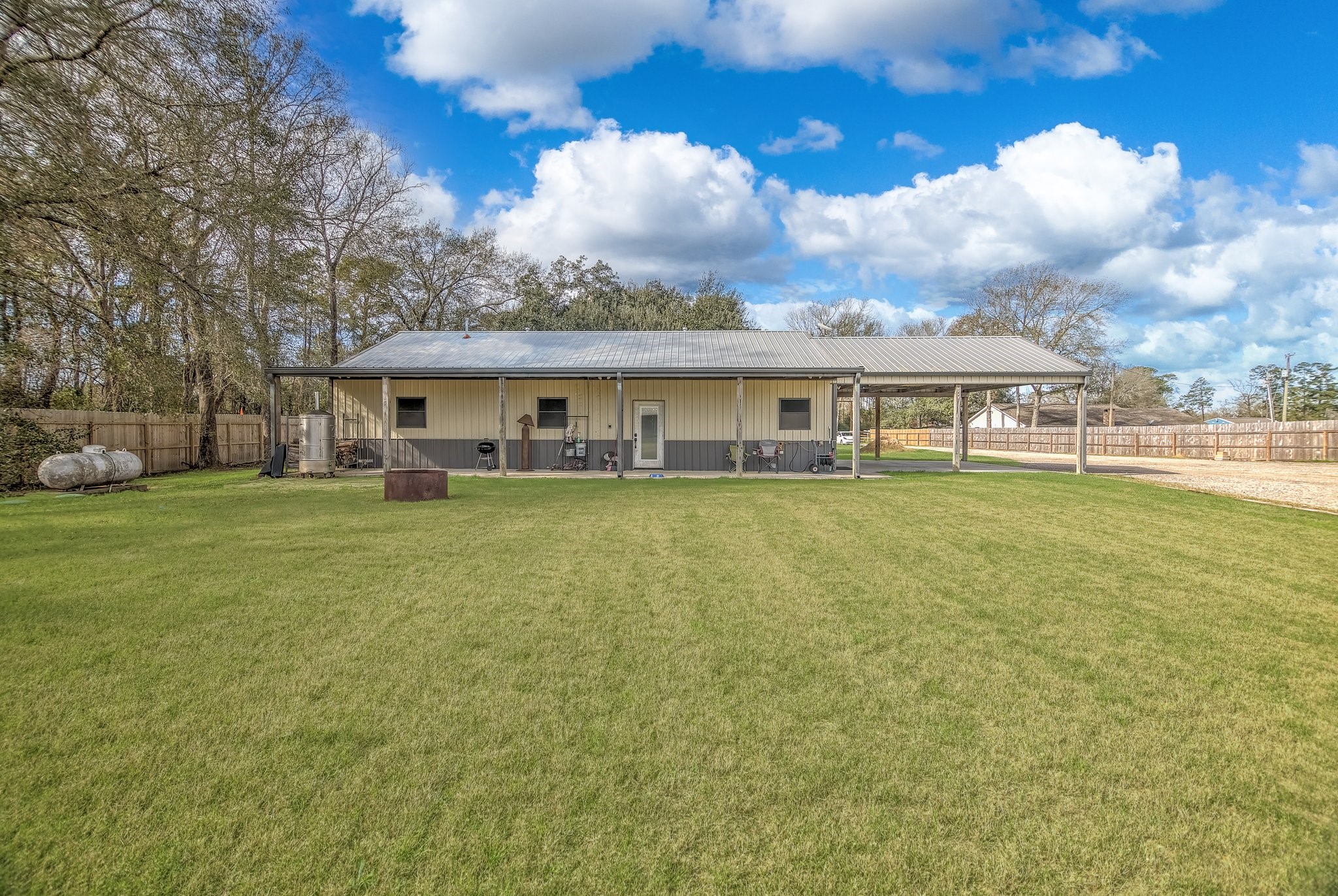 22546 Highway 321 Cleveland, TX 77327 - Photo 28 of 34 a view of house with yard and sitting area
