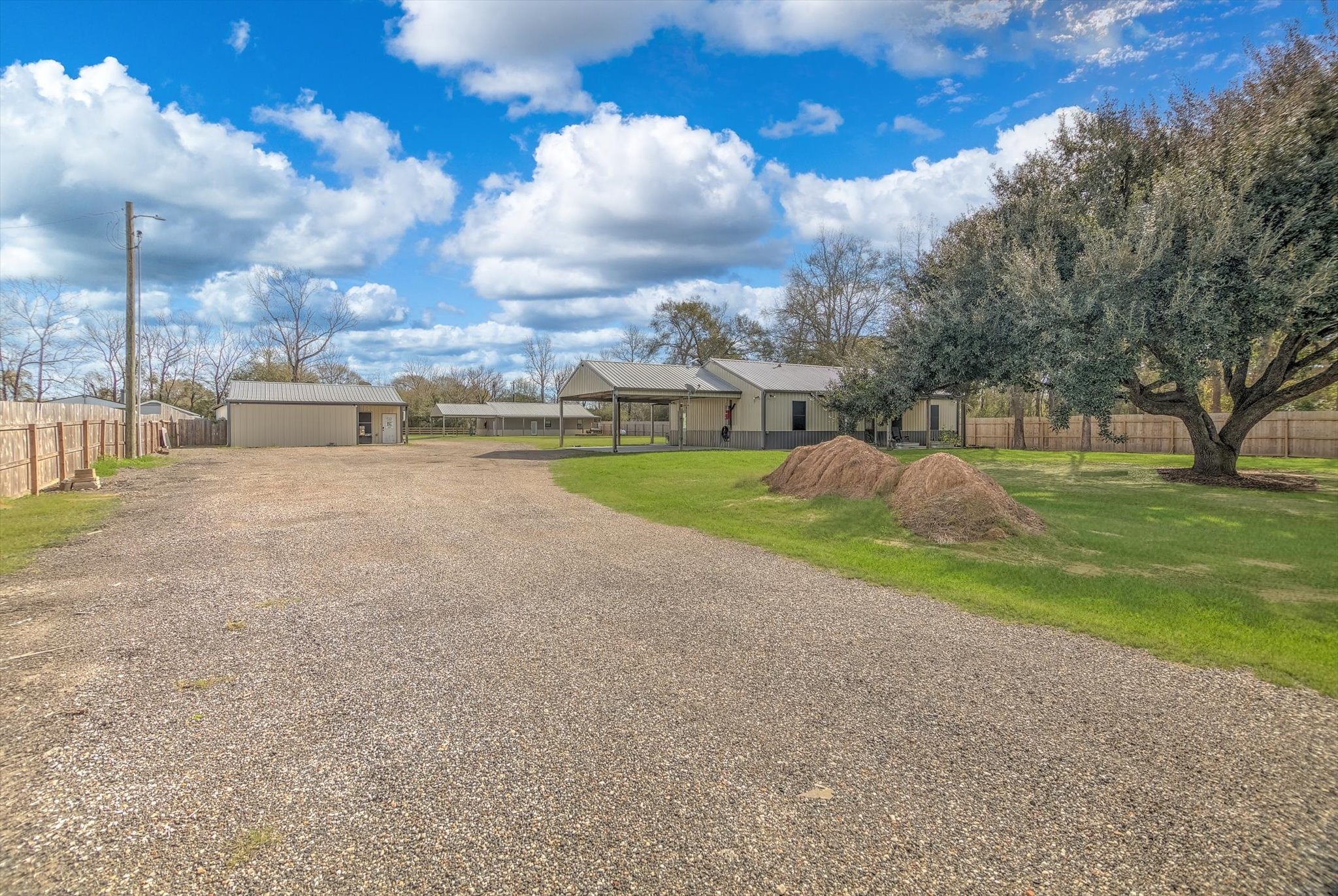 22546 Highway 321 Cleveland, TX 77327 - Photo 30 of 34 a view of a house with a yard