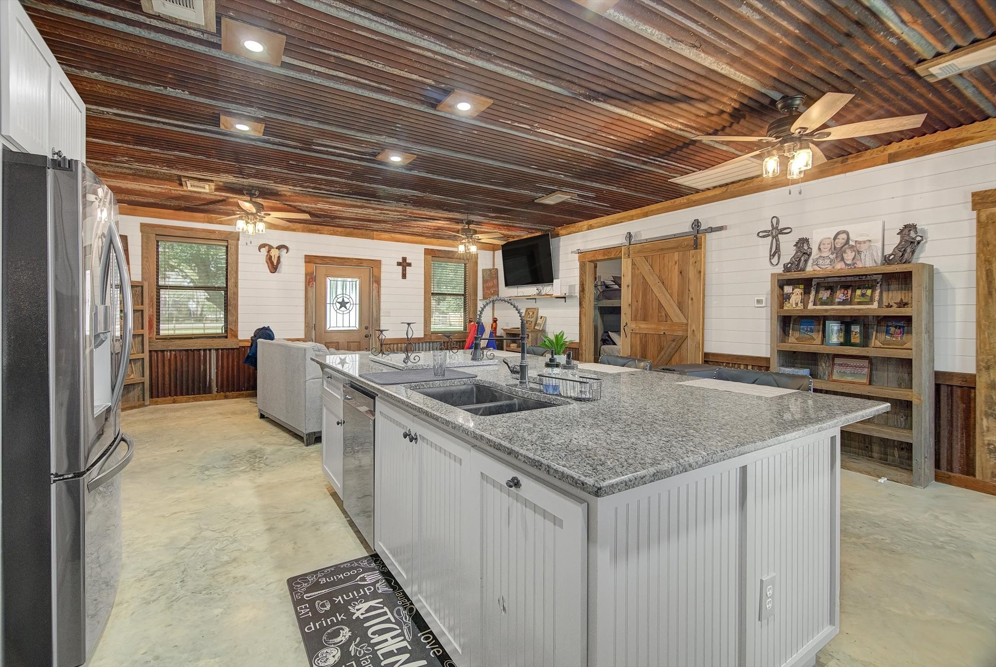 22546 Highway 321 Cleveland, TX 77327 - Photo 7 of 34 a kitchen with stainless steel appliances granite countertop a sink and cabinets