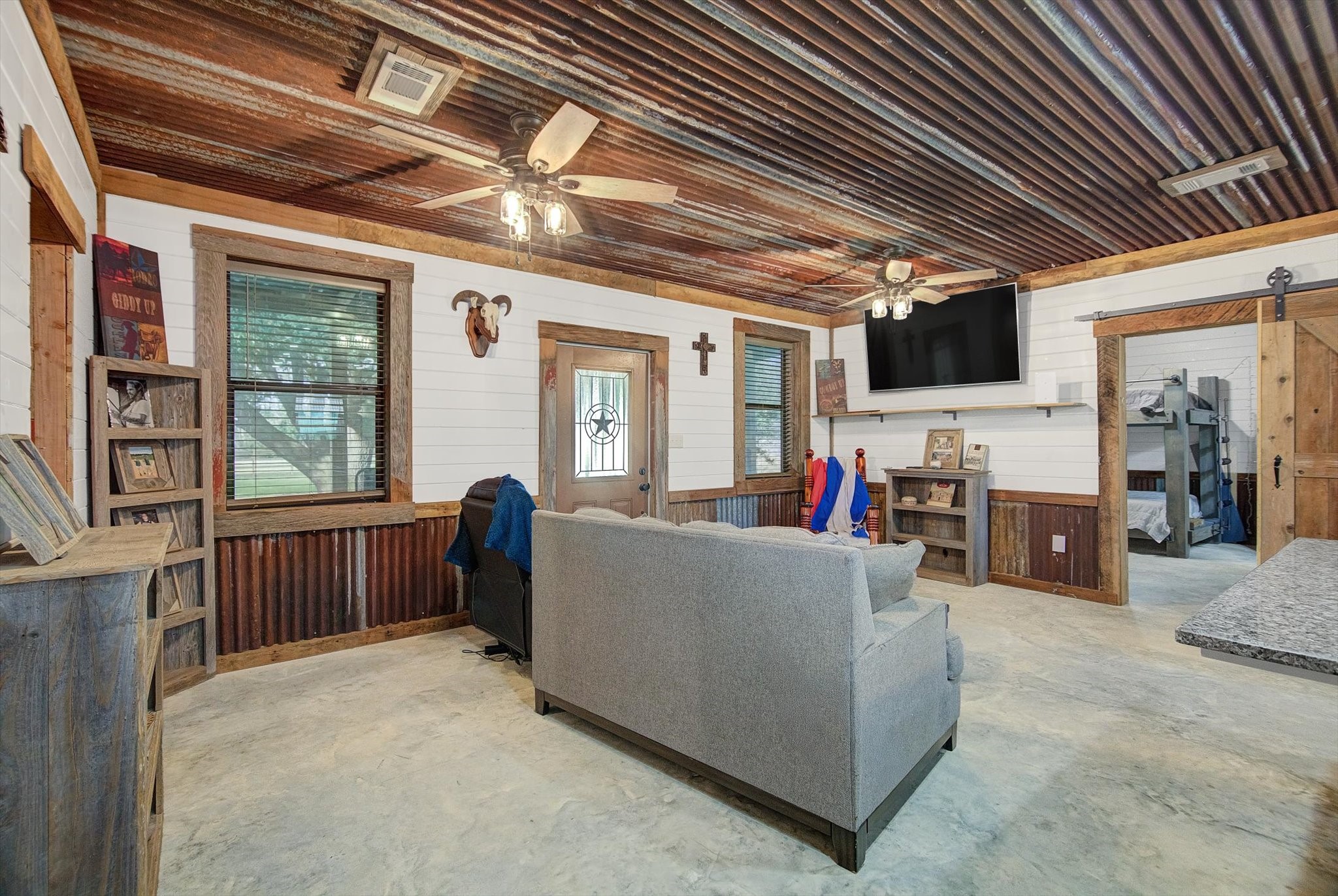 22546 Highway 321 Cleveland, TX 77327 - Photo 9 of 34 a living room with furniture and a large window