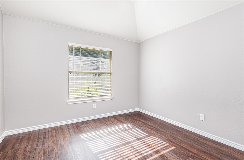 3674 Crowberry Way Fort Worth, TX 76040 - Photo 23 of 26 Spare room with dark wood finished floors and baseboards