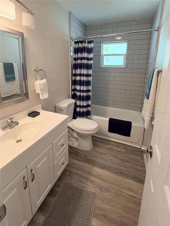 6693 Engram Road New Smyrna Beach, FL 32169 - Photo 8 of 18 a bathroom with a sink a toilet and shower