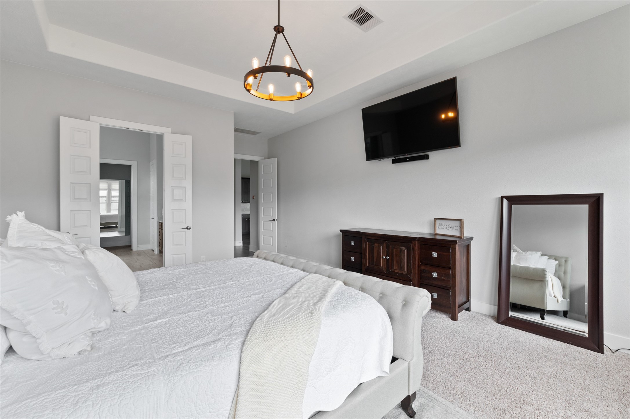 1102 McMurtry Ridge Drive Katy, TX 77494 - Photo 20 of 41 a bedroom with a bed and a flat screen tv