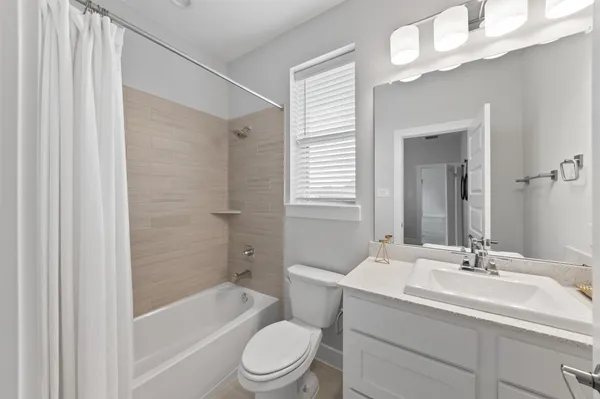 a front view of a house with garden and porch