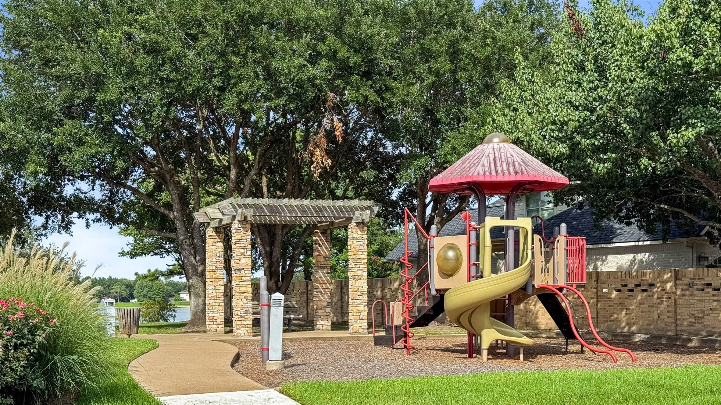 1102 McMurtry Ridge Drive Katy, TX 77494 - Photo 39 of 41 an outdoor space with furniture and umbrella