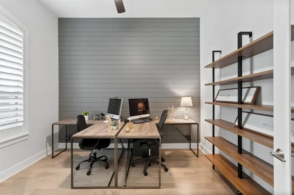 a view of a workspace with furniture