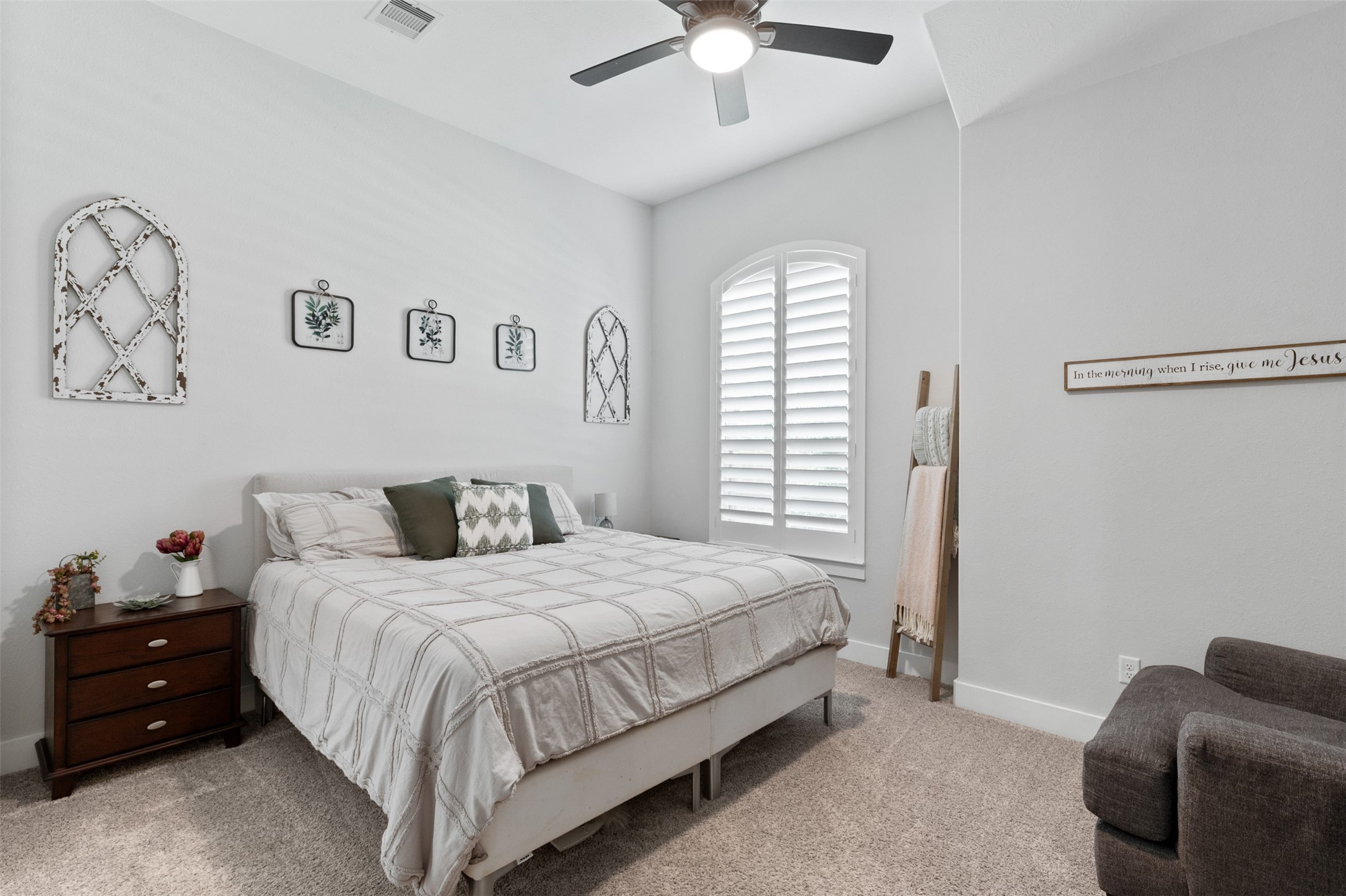 1102 McMurtry Ridge Drive Katy, TX 77494 - Photo 6 of 41 a bedroom with a bed and a chandelier