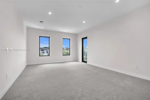 a bathroom with a granite countertop sink a shower and a mirror