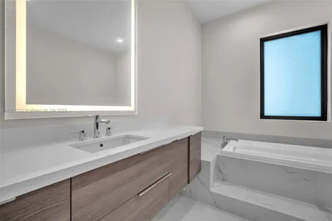 a view of a house with a swimming pool and a yard