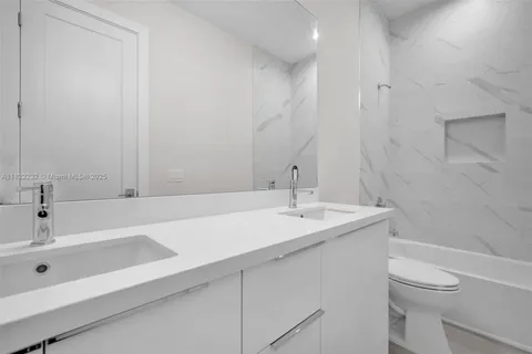 a front view of a house with a yard table and chairs