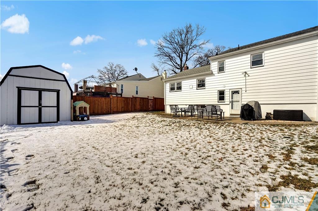 675 Colonial Arms Road Union, NJ 07083 - Photo 22 of 25 a backyard of a house with a barbeque and outdoor seating