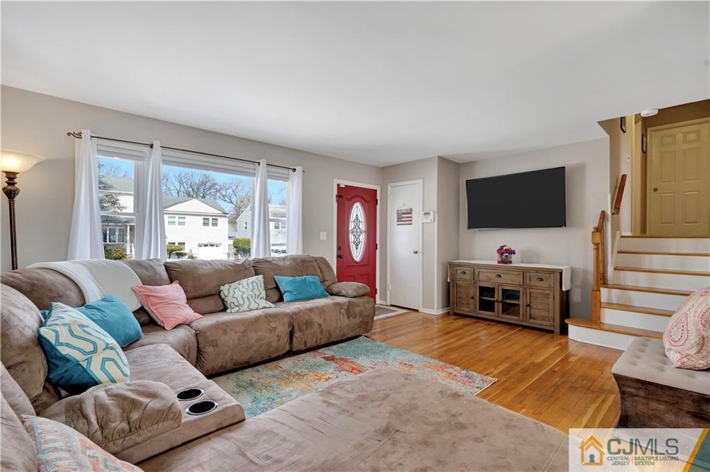 675 Colonial Arms Road Union, NJ 07083 - Photo 5 of 25 a living room with furniture and a flat screen tv