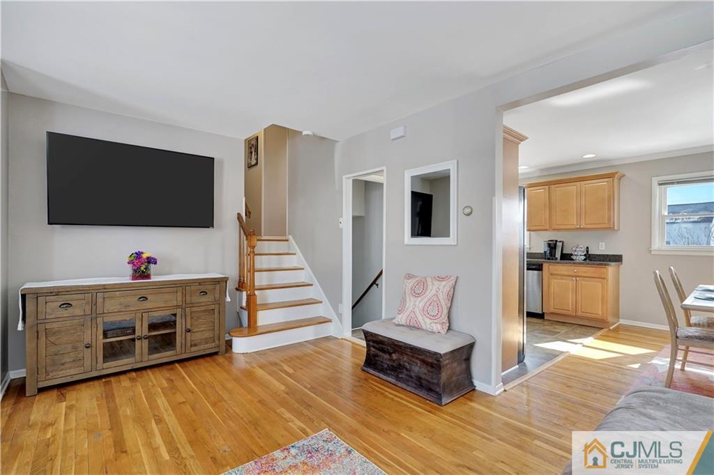 675 Colonial Arms Road Union, NJ 07083 - Photo 6 of 25 a living room with furniture and flat screen tv