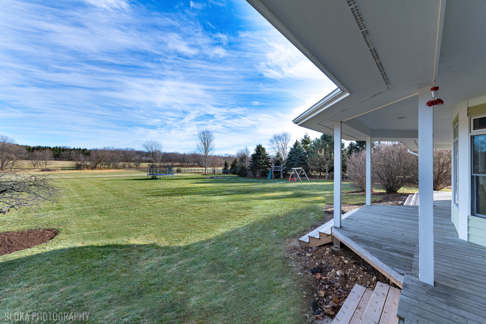 2908 Oak Ridge Road Crystal Lake, IL 60012 - Photo 4 of 53 a view of a house with a big yard