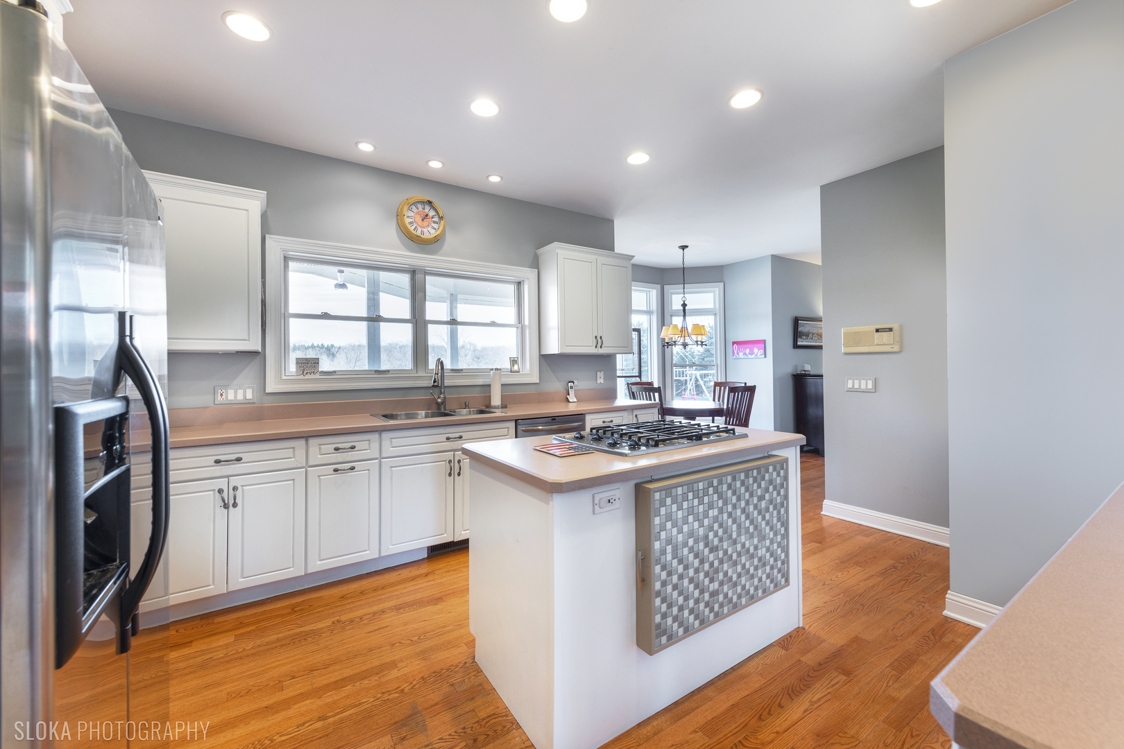 2908 Oak Ridge Road Crystal Lake, IL 60012 - Photo 8 of 53 a kitchen with a stove and a sink