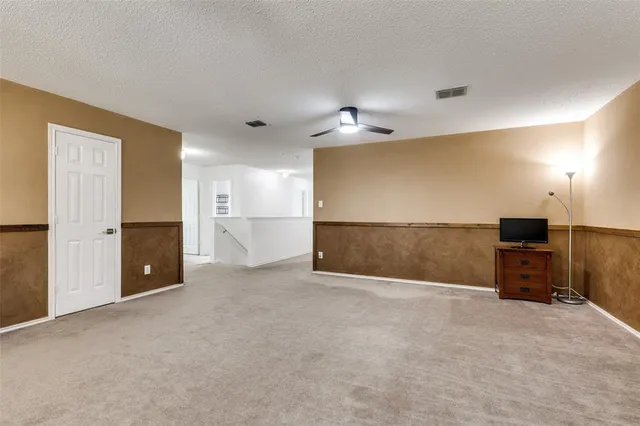 a view of a livingroom with a kitchen