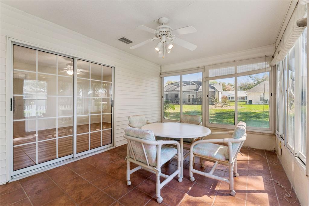 27217 Racquet Circle Leesburg, FL 34748 - Photo 31 of 90 a view of a dining room with furniture window and outside view