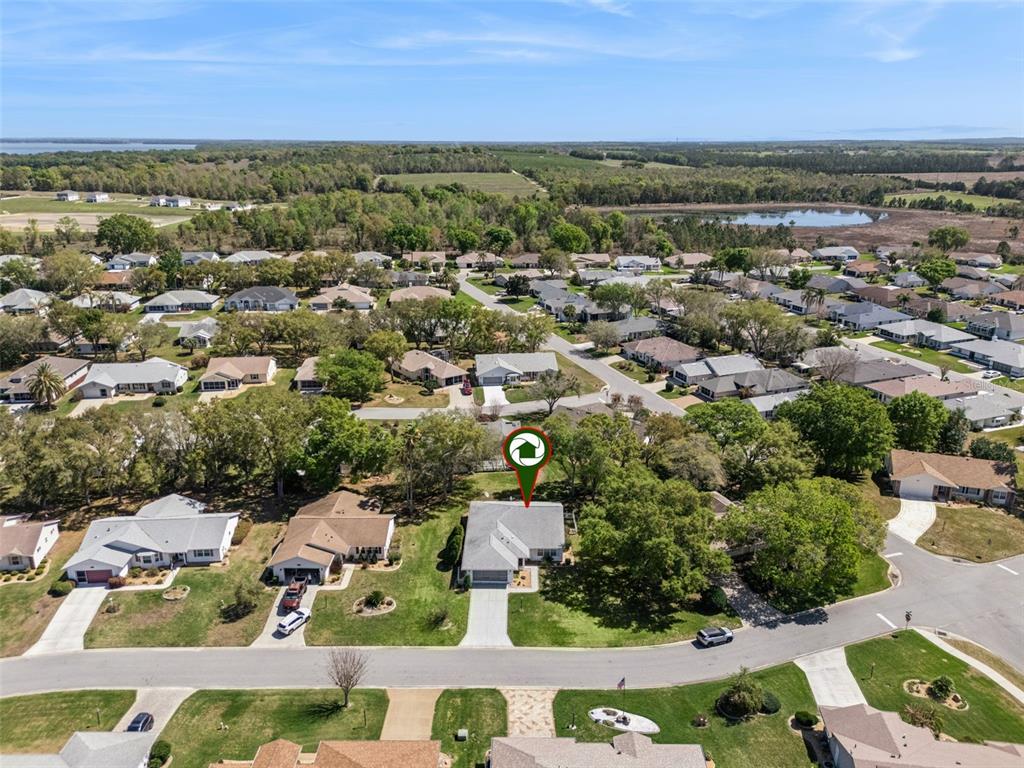 27217 Racquet Circle Leesburg, FL 34748 - Photo 41 of 90 an aerial view of residential houses with outdoor space and street view