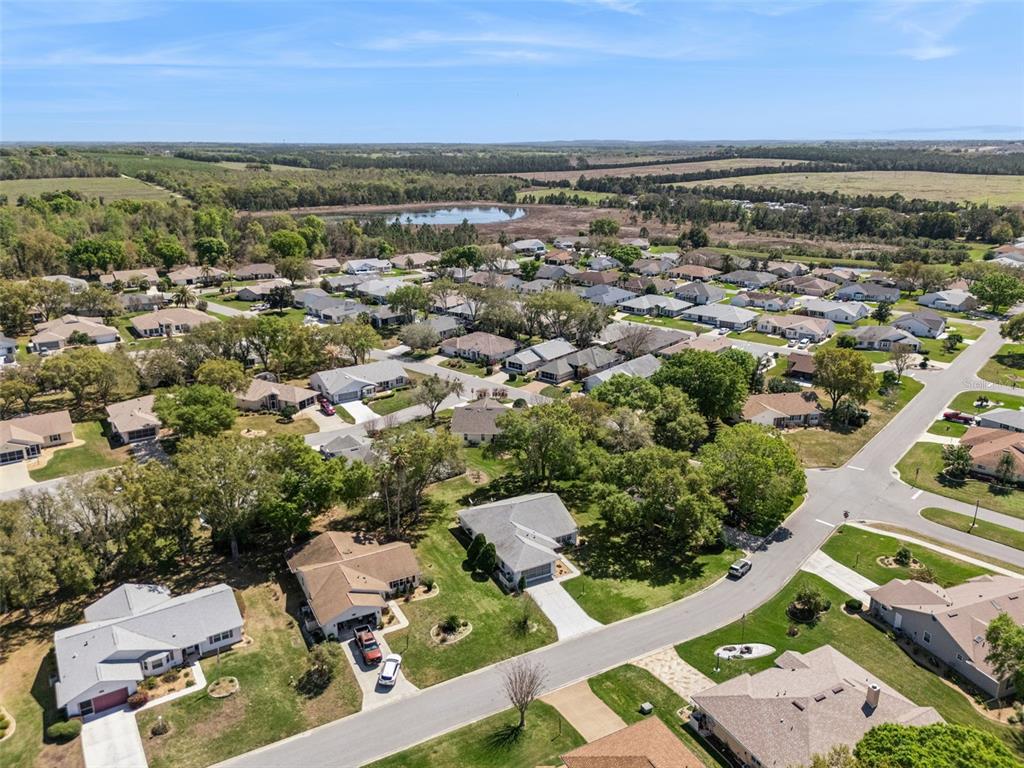 27217 Racquet Circle Leesburg, FL 34748 - Photo 42 of 90 an aerial view of a houses with a lake view