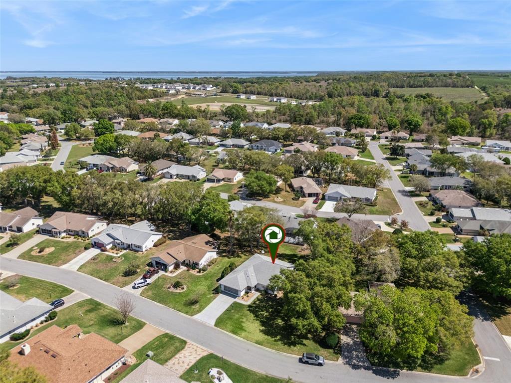27217 Racquet Circle Leesburg, FL 34748 - Photo 44 of 90 an aerial view of residential houses with outdoor space and street view