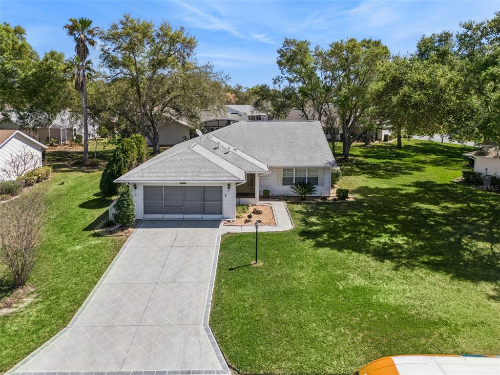 27217 Racquet Circle Leesburg, FL 34748 - Photo 5 of 90 a aerial view of a house with a yard