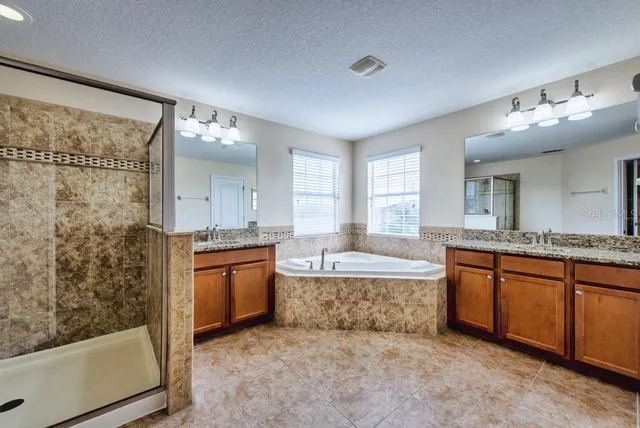 a view of a livingroom with a ceiling fan and window