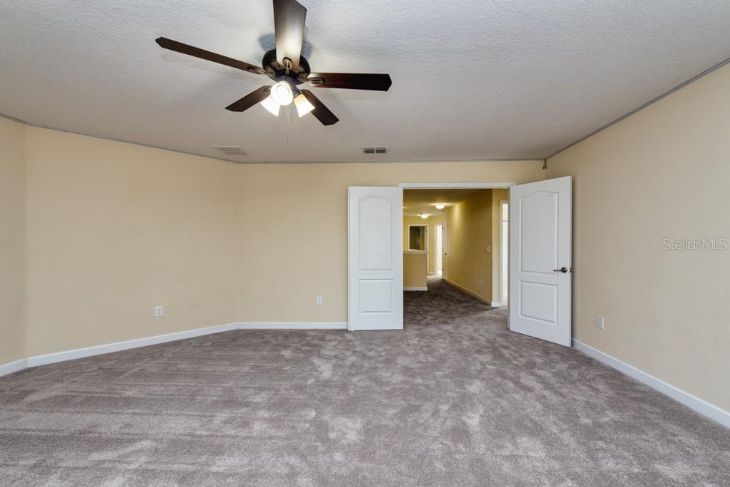 2409 Allegheny Valley Street Ruskin, FL 33570 - Photo 25 of 53 a view of a livingroom with a ceiling fan and window