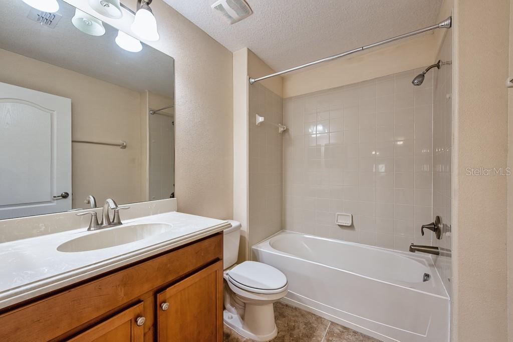 2409 Allegheny Valley Street Ruskin, FL 33570 - Photo 30 of 53 a bathroom with a sink a toilet and shower