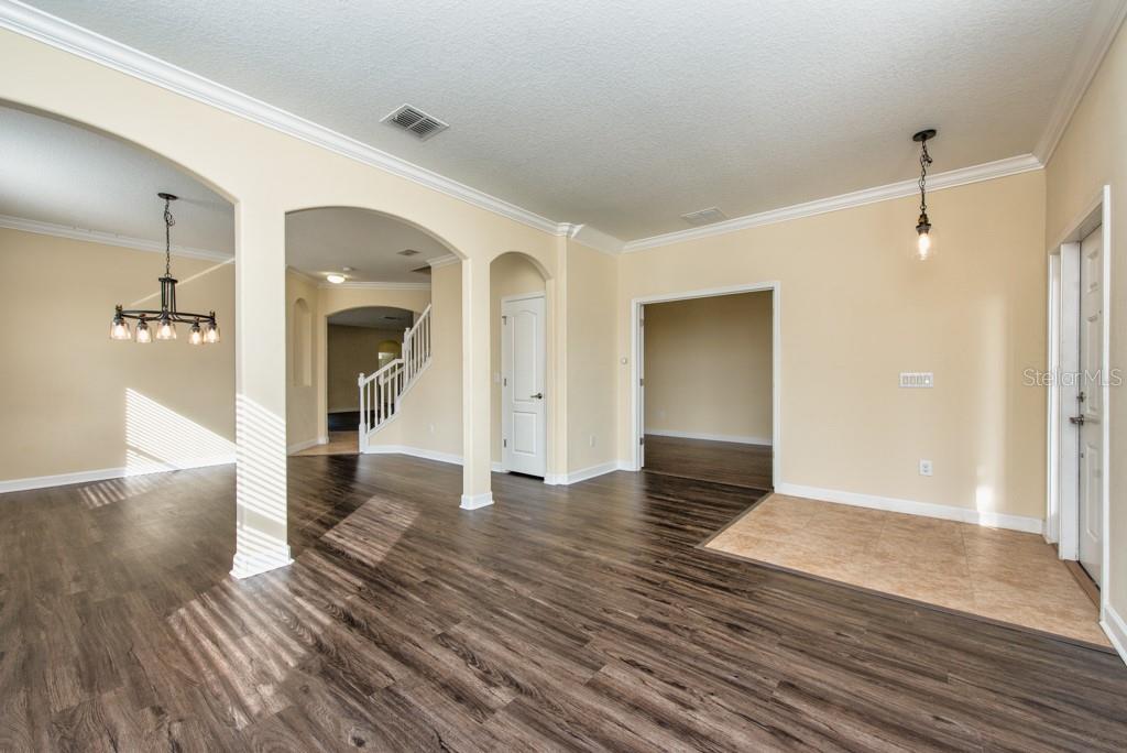 2409 Allegheny Valley Street Ruskin, FL 33570 - Photo 3 of 53 a view of a hallway with wooden floor