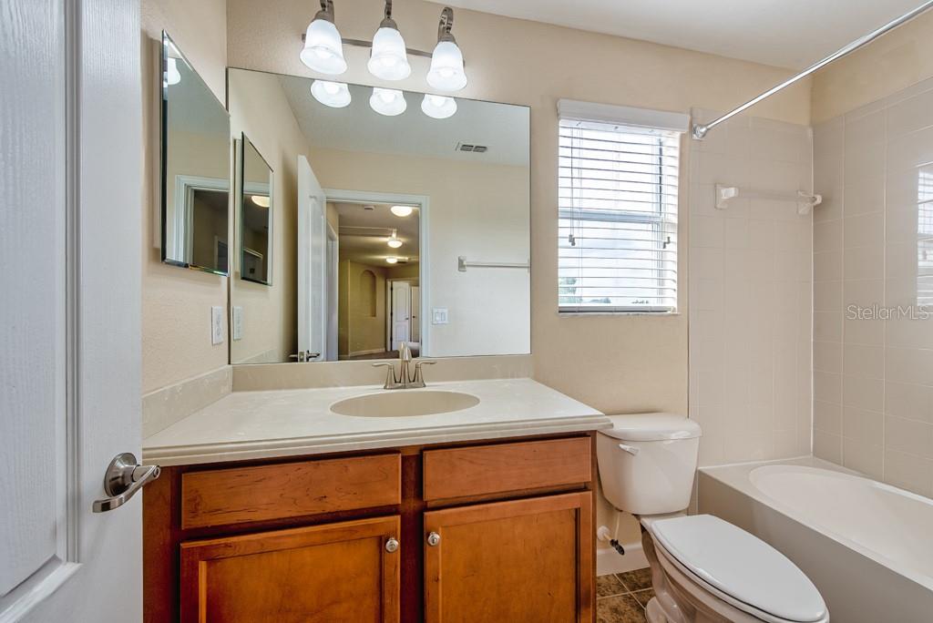 2409 Allegheny Valley Street Ruskin, FL 33570 - Photo 35 of 53 a bathroom with a sink a toilet a mirror and shower