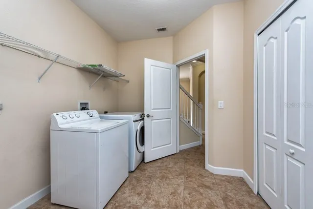 a view of a lake with houses in the back