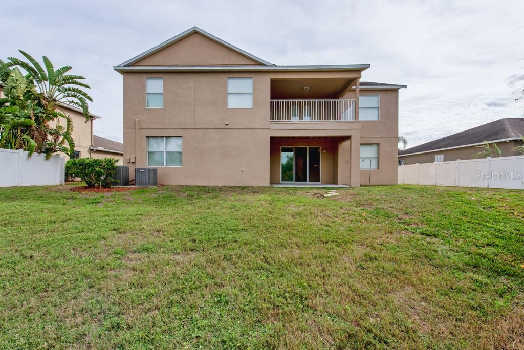 2409 Allegheny Valley Street Ruskin, FL 33570 - Photo 44 of 53 a front view of a house with a yard and garage