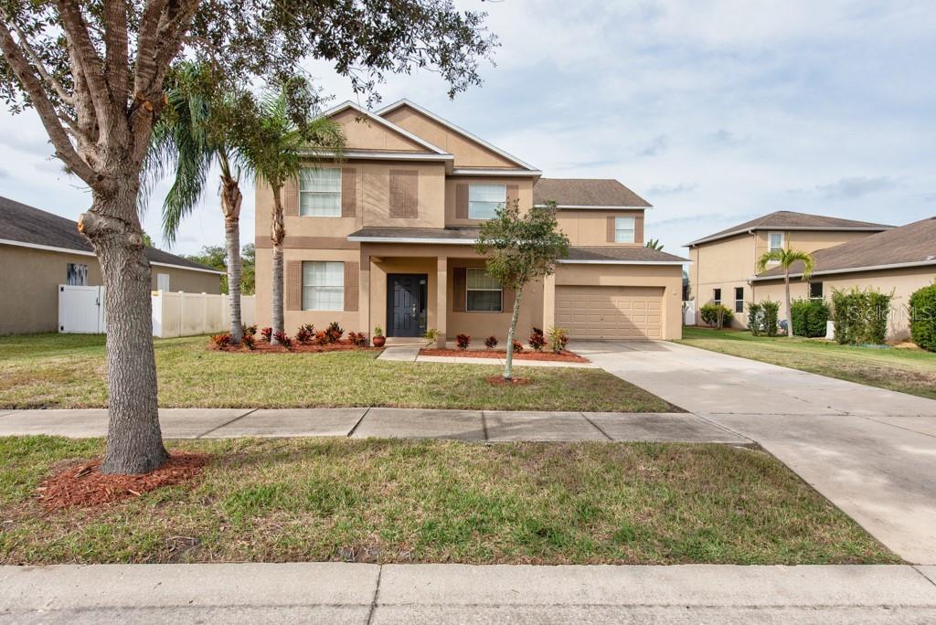 2409 Allegheny Valley Street Ruskin, FL 33570 - Photo 47 of 53 front view of a house with a yard