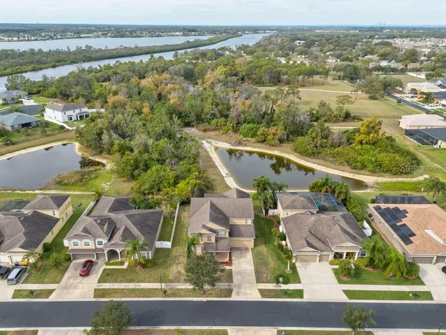 an aerial view of a house with outdoor space