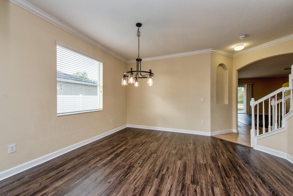 2409 Allegheny Valley Street Ruskin, FL 33570 - Photo 5 of 53 a view of empty room with wooden floor and fan