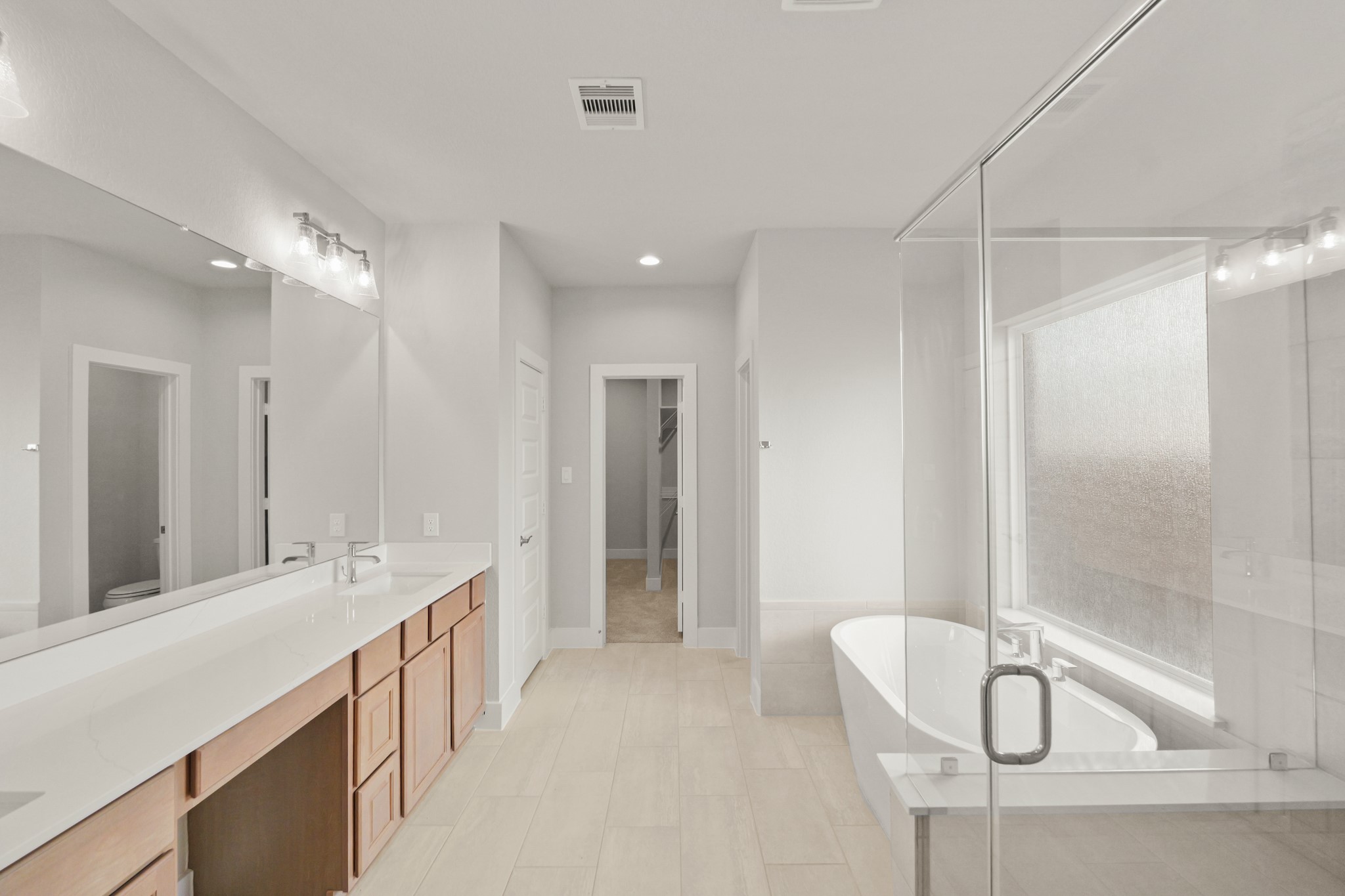 4603 Whisperwood Drive Rosenberg, TX 77471 - Photo 22 of 50 a bathroom with a double vanity sink mirror and shower