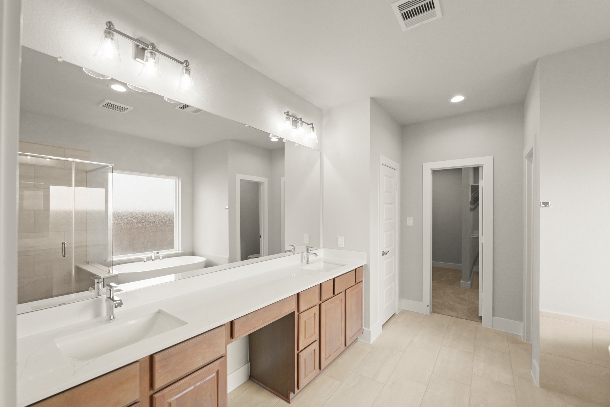 4603 Whisperwood Drive Rosenberg, TX 77471 - Photo 23 of 50 a bathroom with a double vanity sink mirror and double