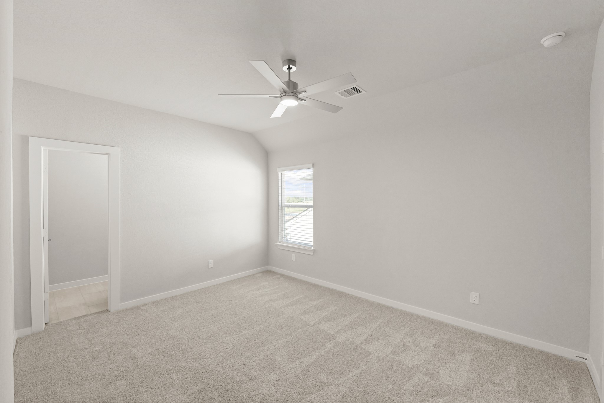 4603 Whisperwood Drive Rosenberg, TX 77471 - Photo 27 of 50 an empty room with a window and ceiling fan