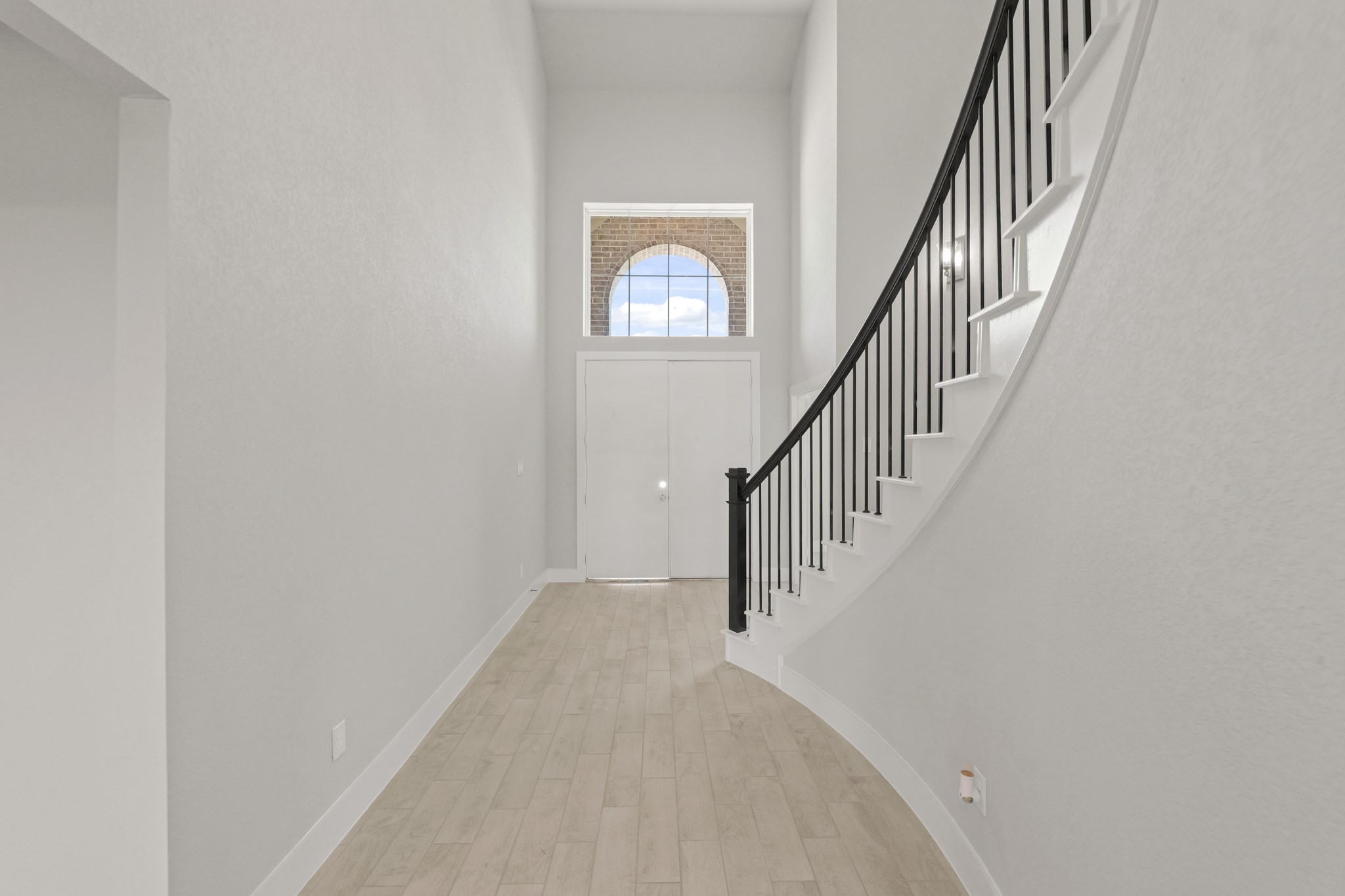 4603 Whisperwood Drive Rosenberg, TX 77471 - Photo 3 of 50 a view of staircase with wooden floor and white walls