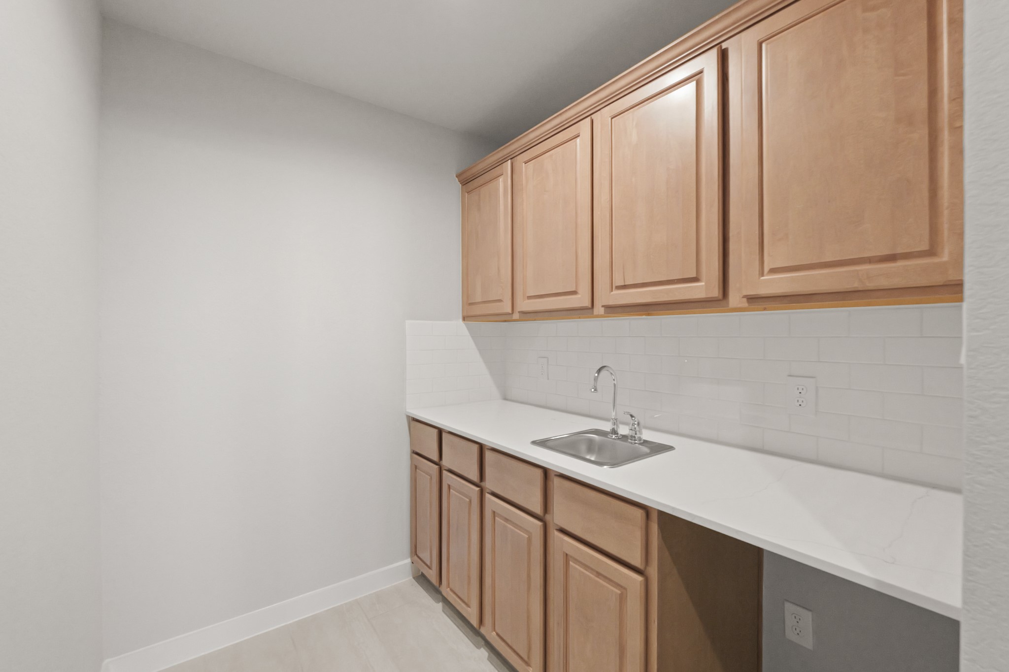 4603 Whisperwood Drive Rosenberg, TX 77471 - Photo 35 of 50 a utility room with stainless steel appliances white cabinets and a sink